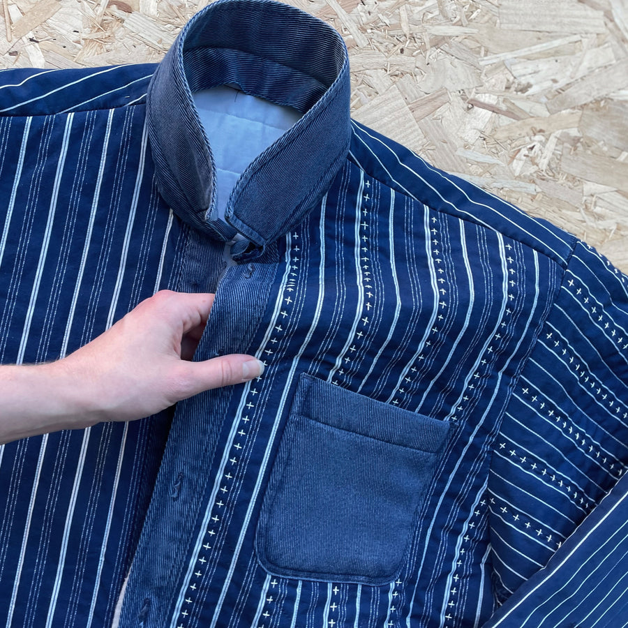 Laura Gostling. Detail of fabric and hand quilting. Repurposed Blue and white stripe cotton shirt with Hand Quilting.