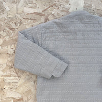 Recut Room Repurposed Hand Quilted Oyster Grey Linen Jacket with an all over hand quilted cross stitch in an off white embroidery thread
