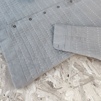 Recut Room Repurposed Hand Quilted Oyster Grey Linen Jacket with an all over hand quilted cross stitch in an off white embroidery thread