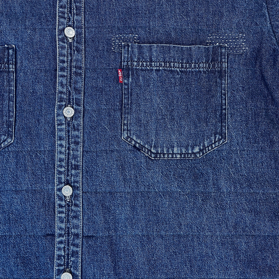 Repurposed vintage Levis denim shirt with 2 chest patch pockets and visible mending - Detail shot of chest pocket and buttons