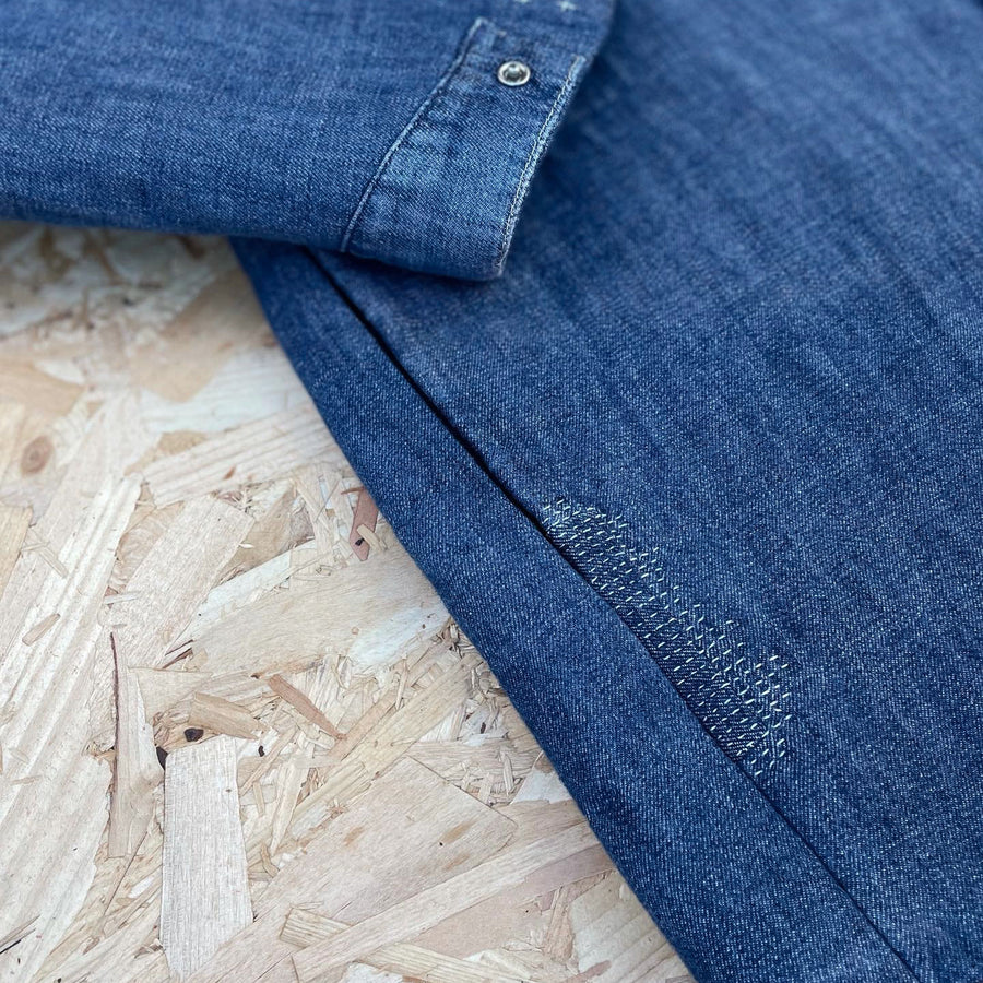 Recut Room Repurposed Levis Engineered jacket with visible mending in contrast off white stitch
