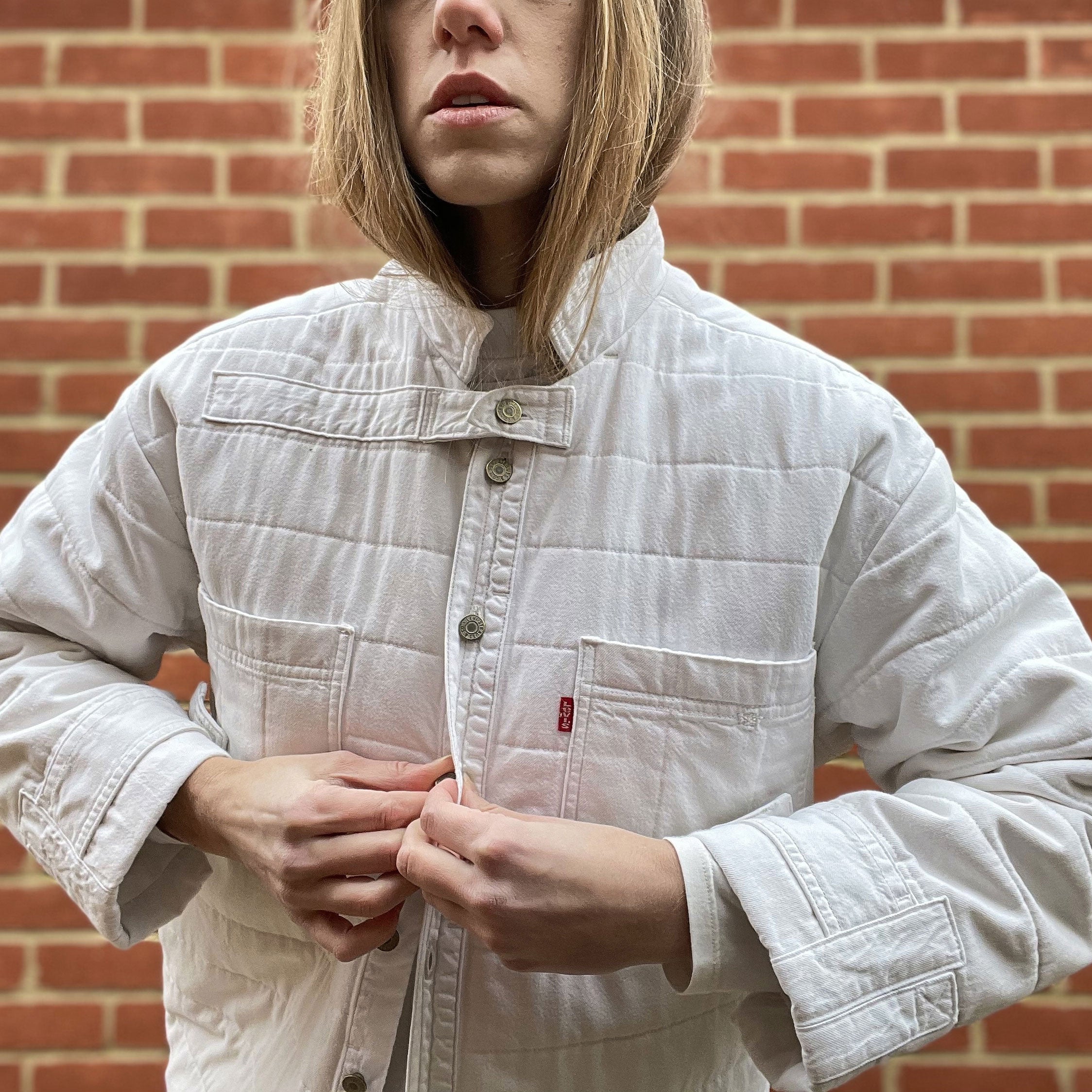 Repurposed vintage Levi's denim jacket with chest pockets and button closure
